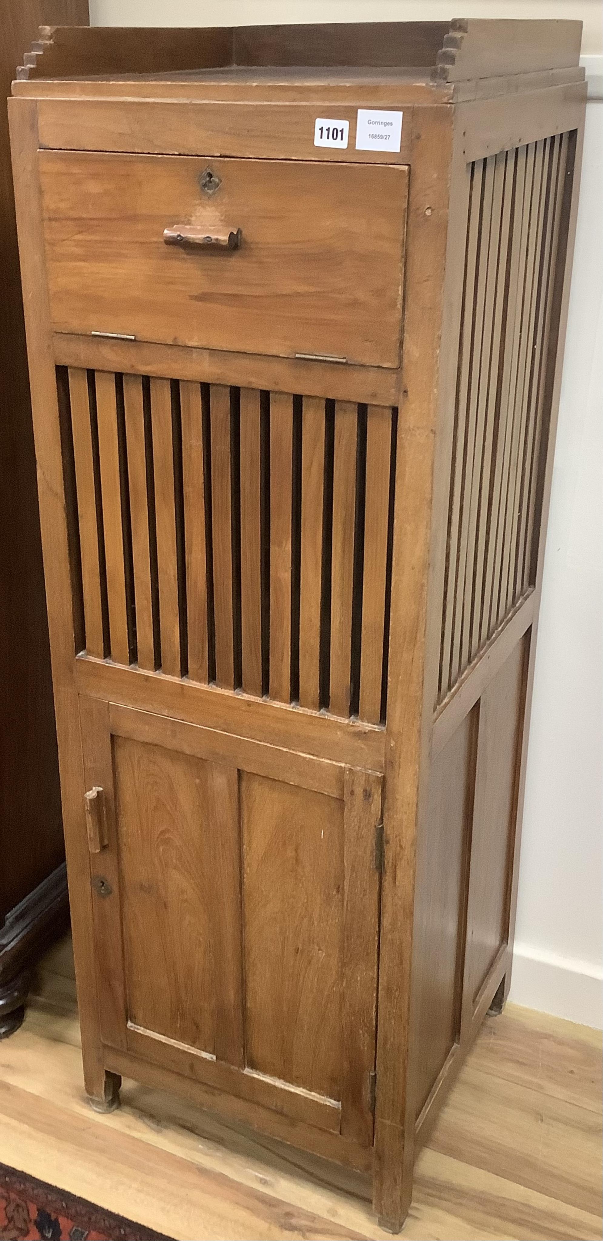 A 20th century Arts & Crafts style Anglo Indian teak laundry cabinet, width 45cm, depth 45cm, height 135cm. Condition - fair